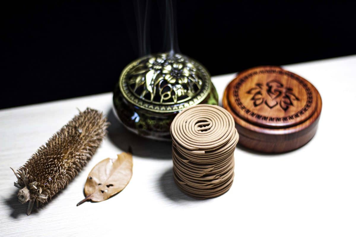 spiral agarwood incense and a censer