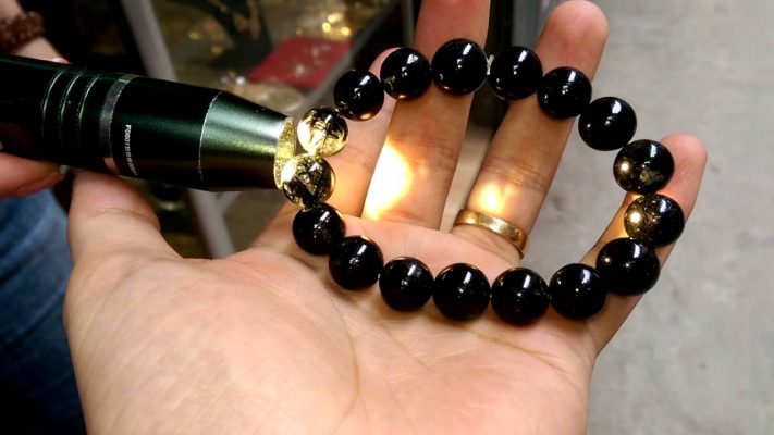 Light will not penetrate 100% of real black quartz; use a flashlight to inspect the clarity; there are numerous fissures inside.