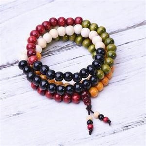 the bracelet with red, green, white and black beads