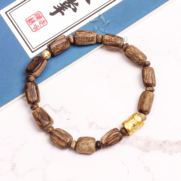 Unshaped agarwood bead with Tibet 24K Gold charm
